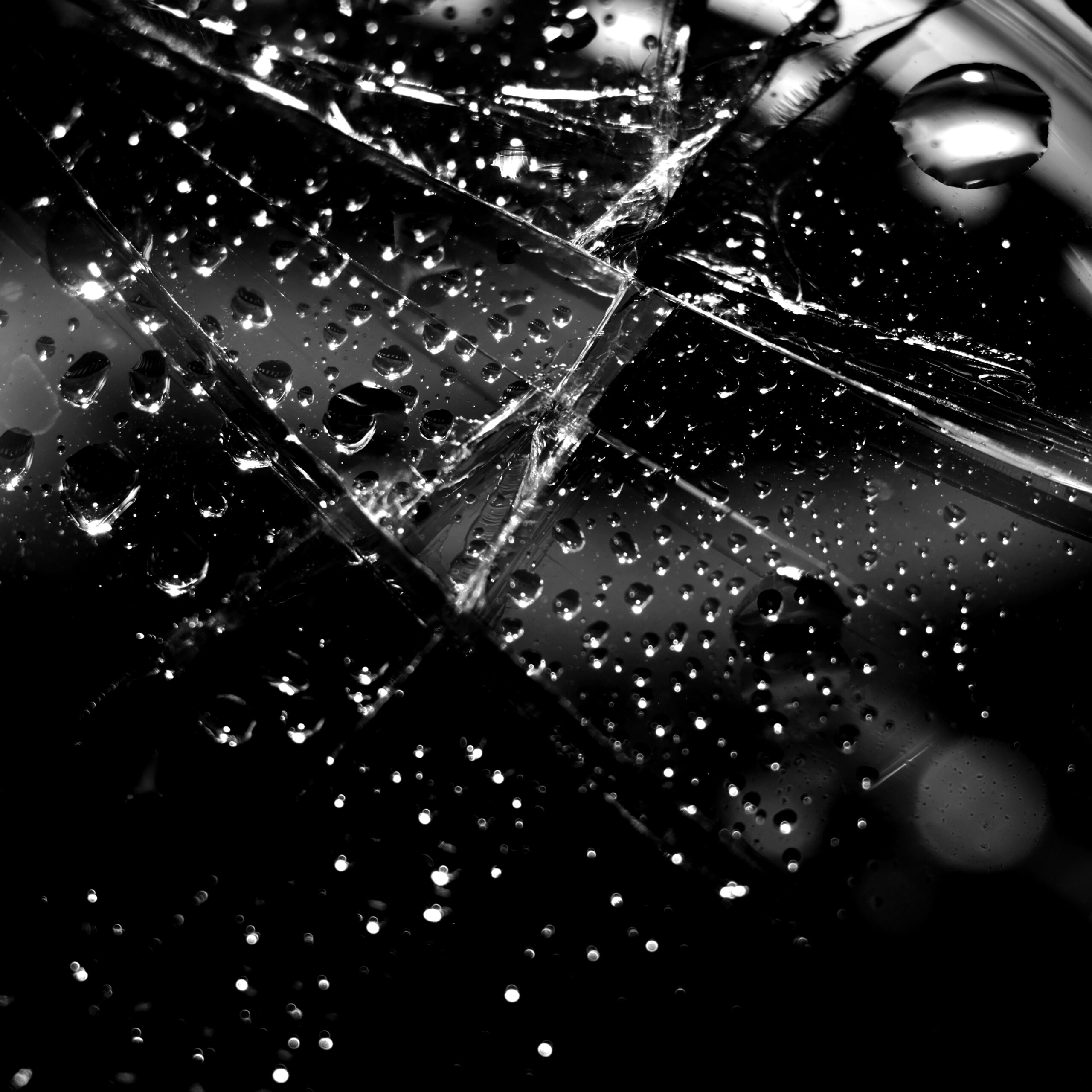 abstract-black-broken-glass-background-with-droplets (1)